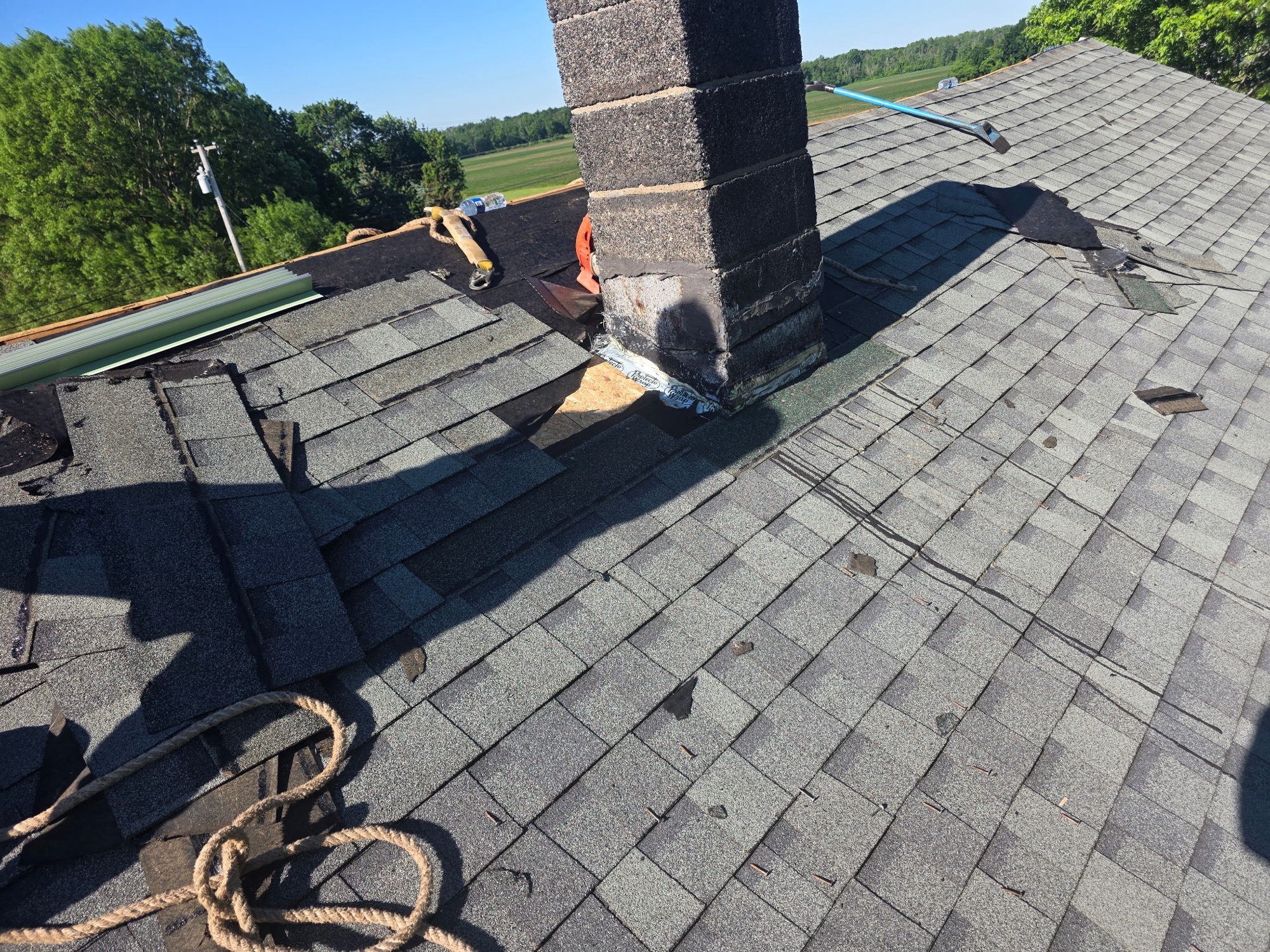 Old chimney flashing exposed during a Batavia roof repair