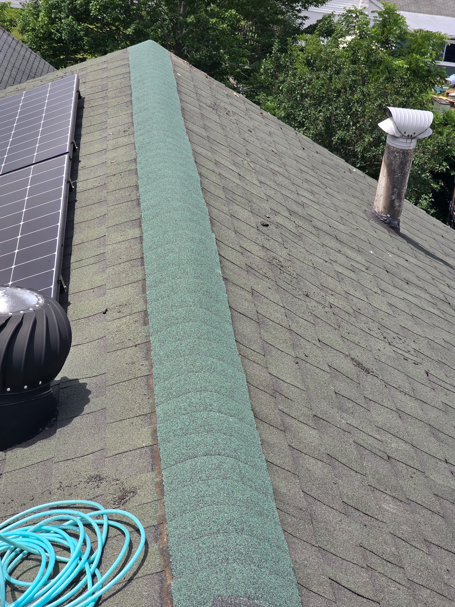 New ridge-cap shingles after repair in Batavia