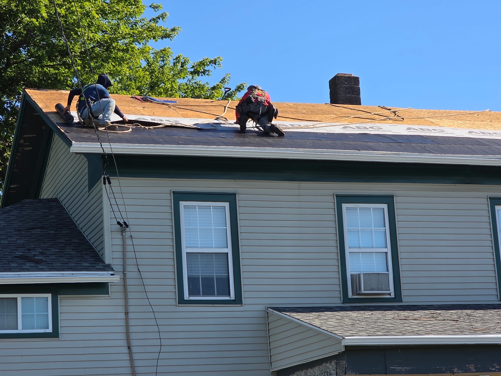 Top Roof crew preparing a roof deck during a Batavia roof replacement