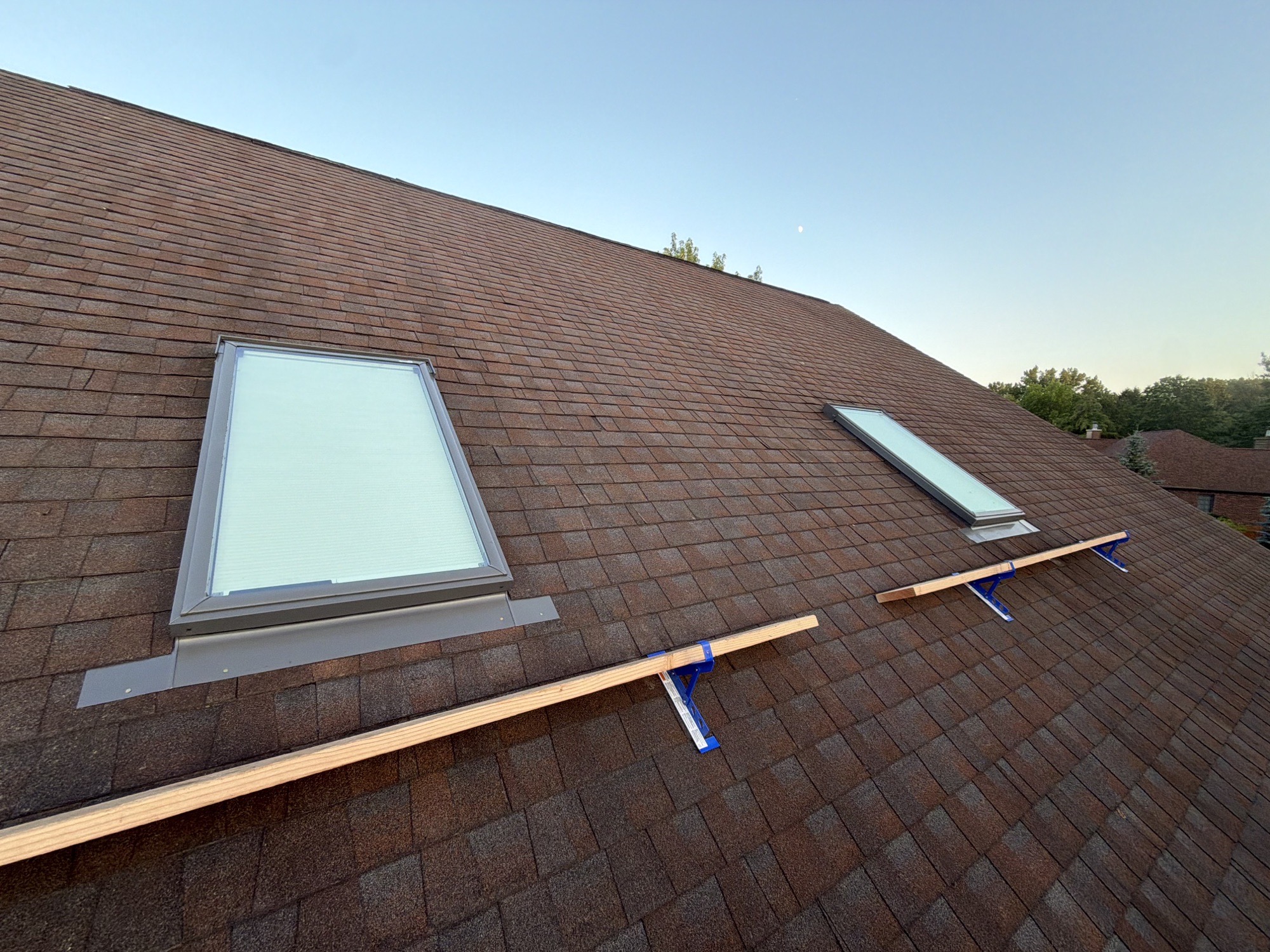 Replacement skylights integrated into a Batavia asphalt roof