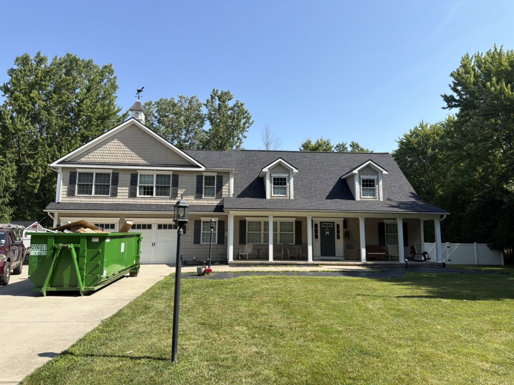 Completed asphalt-shingle roof replacement on a home in Albion, NY.